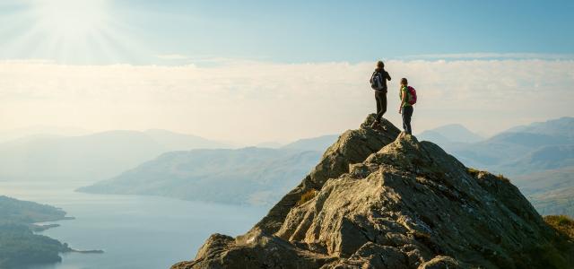Hikers on top of the mountain enjoying view